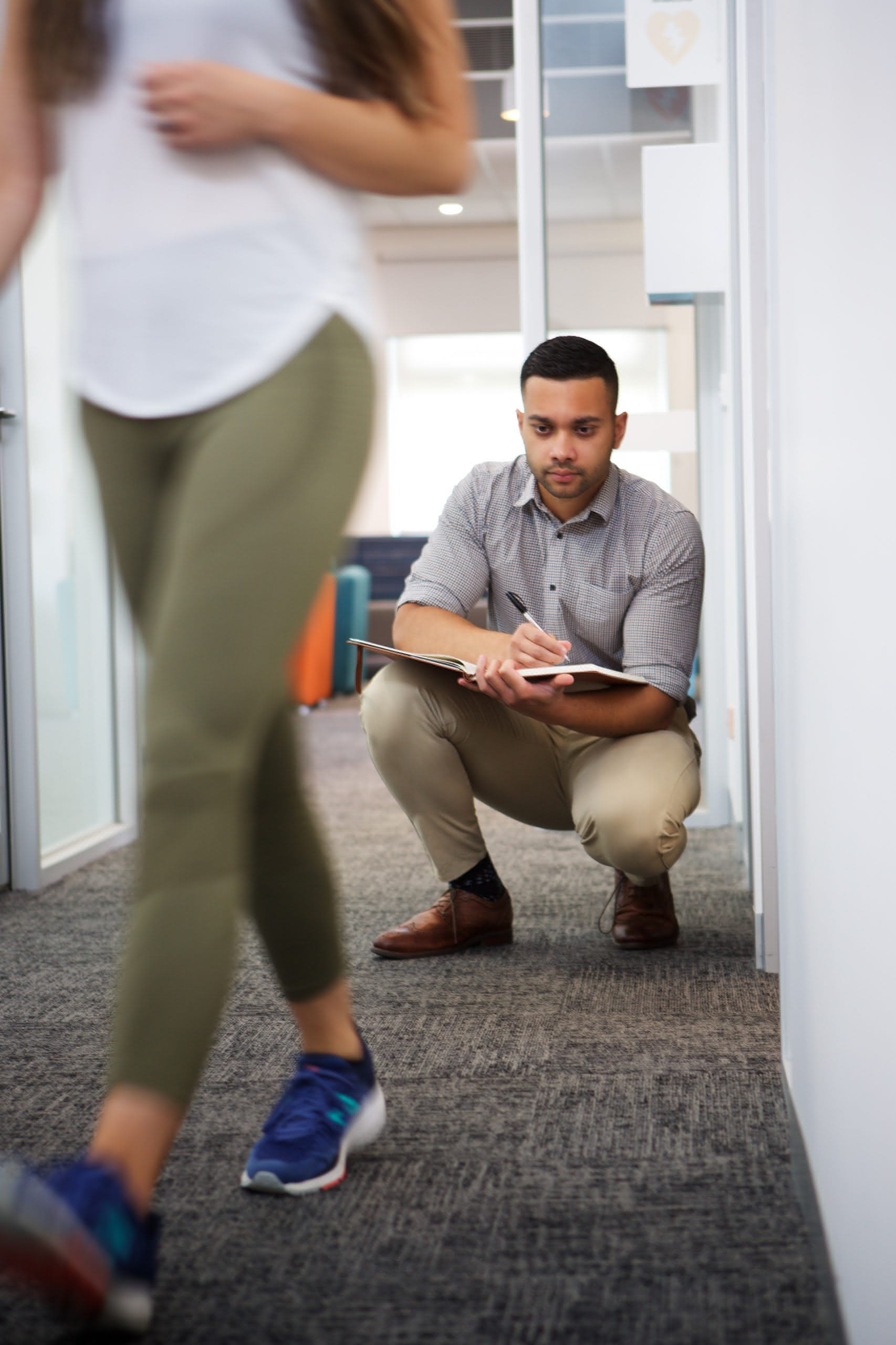 a podiatrist analysing the gait of a client